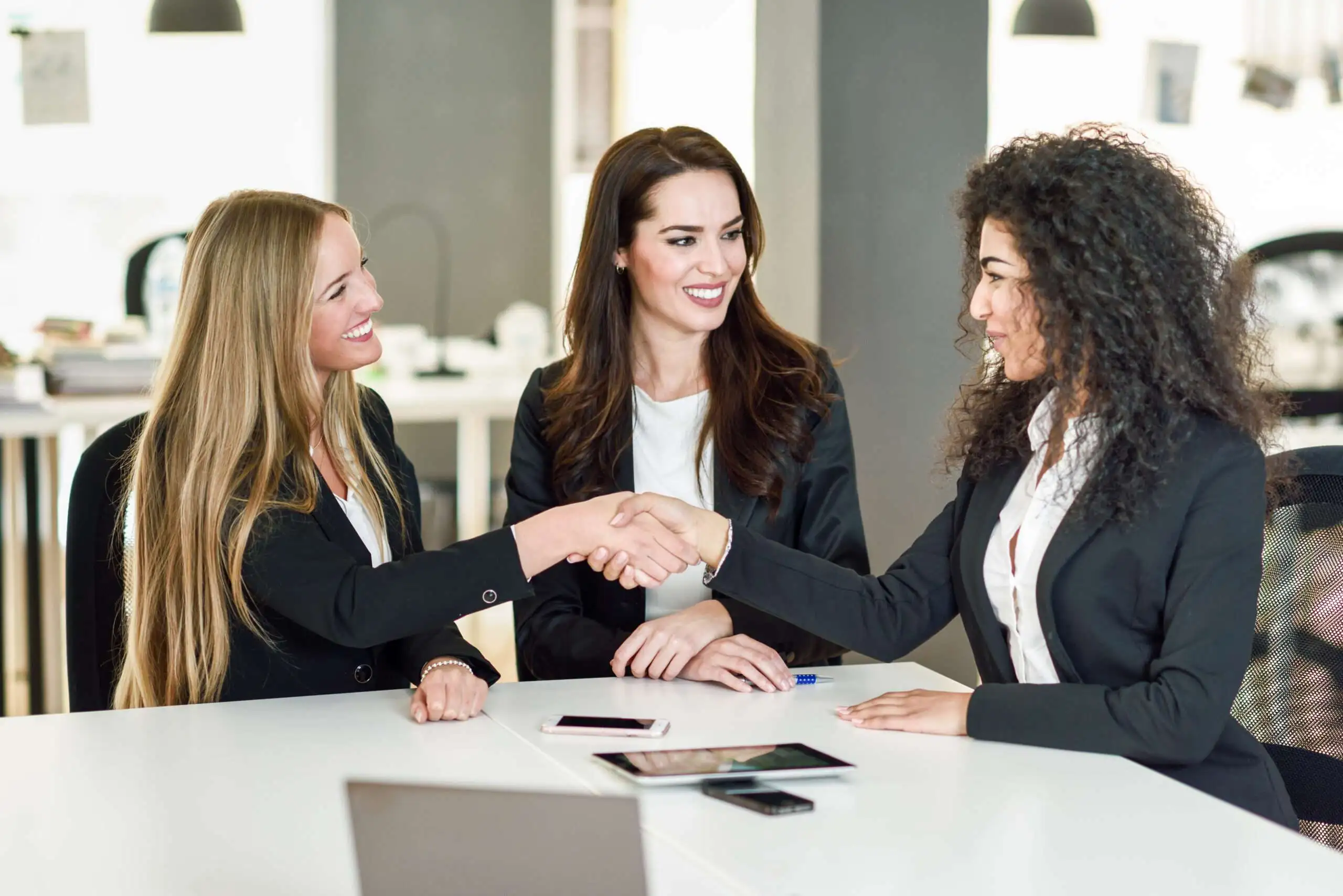 https://cloudaccountants.co/wp-content/uploads/2023/03/three-businesswomen-shaking-hands-modern-office-1-scaled-compressed.webp